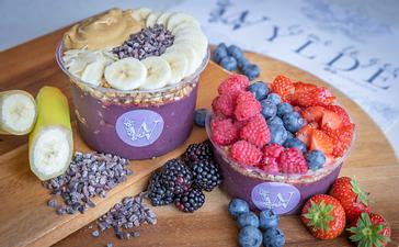HYDE Hotel | Galway | 2 Colourful acai bowels topped with berries, peanut butter  and bananas at WYLDE cafe