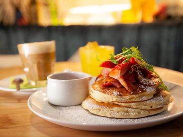 HYDE Hotel | Galway | stack of pancakes next to coffee and syrup