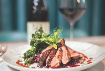 HYDE Hotel | Galway | steak and wine at a dinner setting in HYDE bar