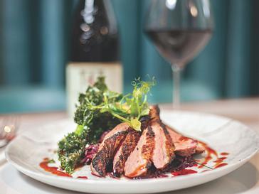 HYDE Hotel | Galway | steak and wine at a dinner setting in HYDE bar